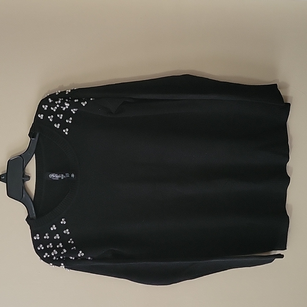 Small black sweater with pearl detail on shoulders